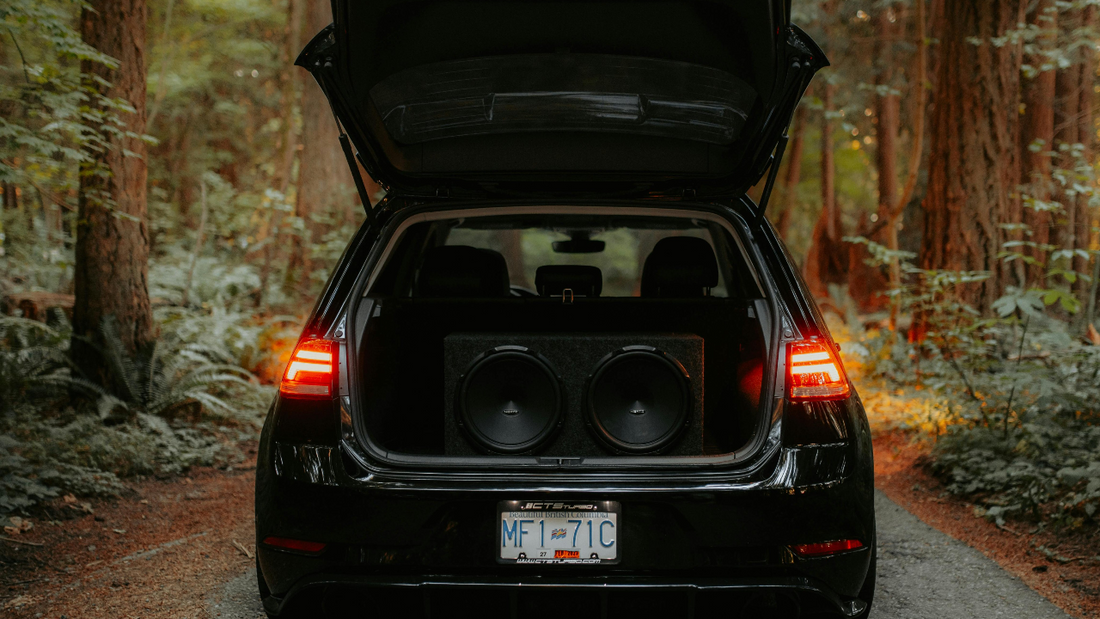 The back view of a car with speakers