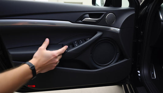 Clean interior car door with stock speaker being swapped for a plug-and-play aftermarket speaker